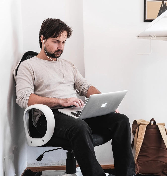 Elixir developer working on a laptop